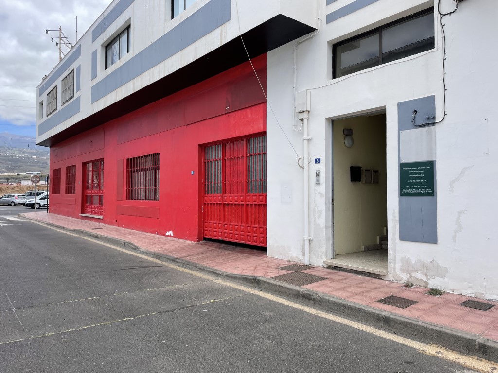 Shows the entrance to the bookshop with the street in view